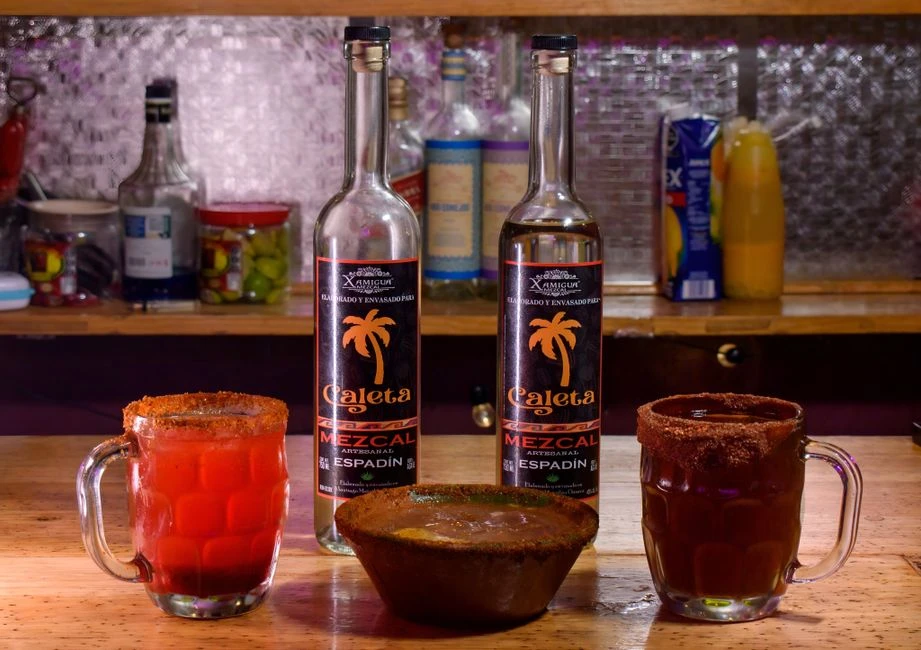 Traditional Oaxacan mole and mezcal tasting on a market table
